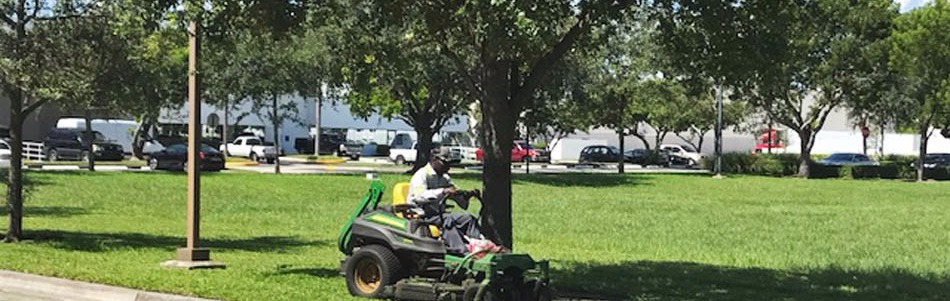 BTS Land Services Corp mowing a commercial property in Weston, FL.
