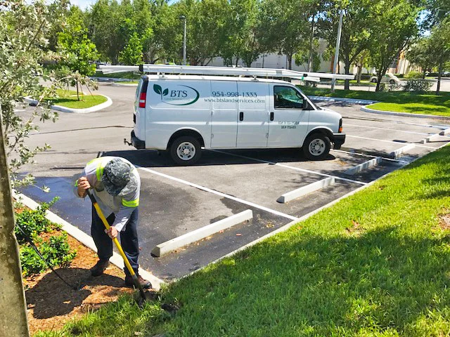 BTS Land Services Corp employee working on irrigation.