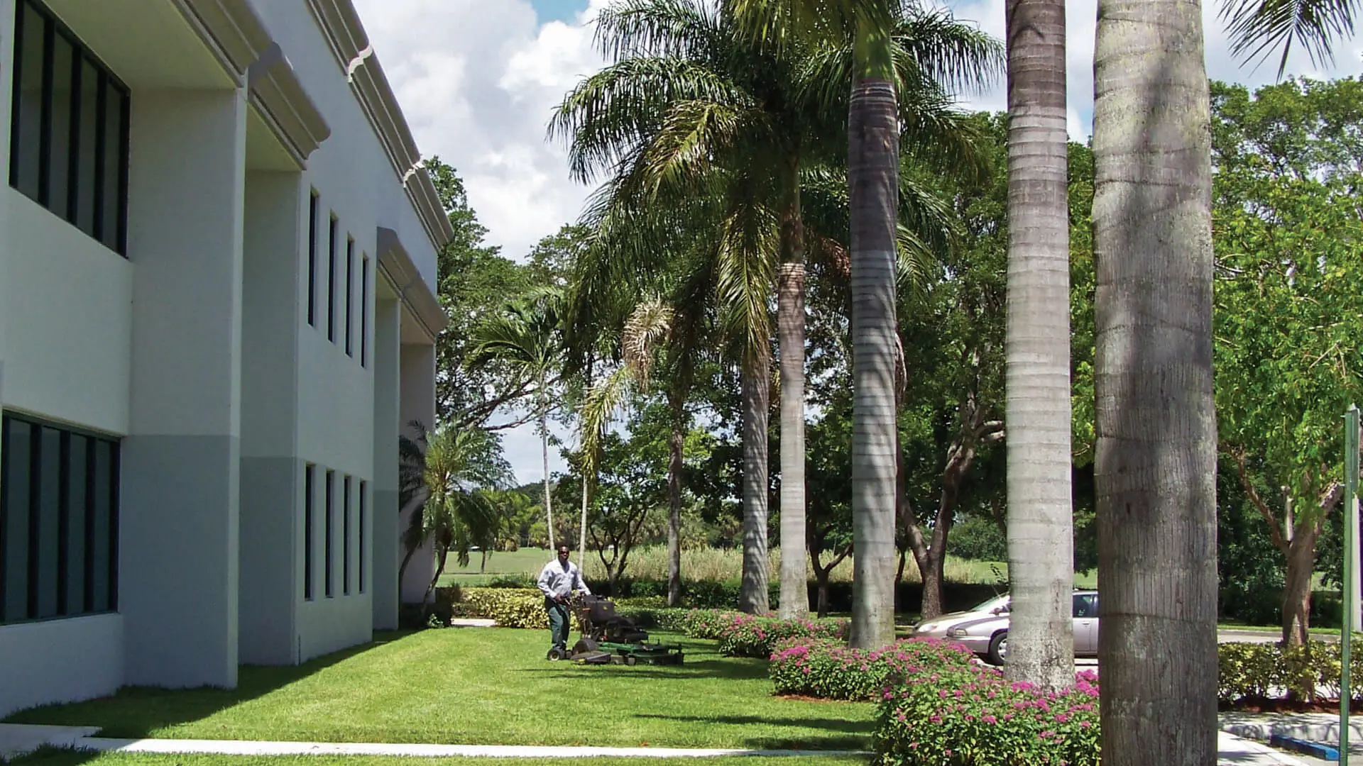 BTS Land Services Corp mowing a condo building in Weston, FL.