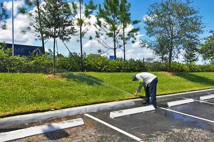 Irrigation system being tested along parking lot in Sunrise, FL.