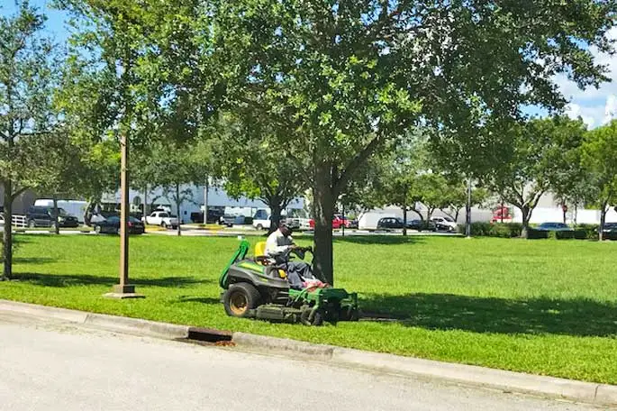 Commercial property in Davie, FL being mowed by our team member.